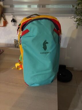 cotopaxi Allpa20 Backpack in Turquoise, Yellow, Red, Purple